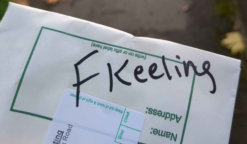 A prescription bag with "Keeling" written on it